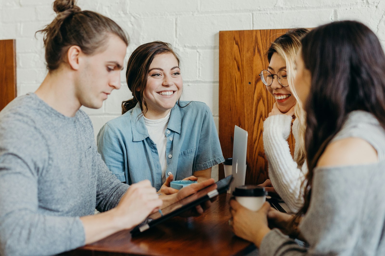 A small group practicing conversation around a table